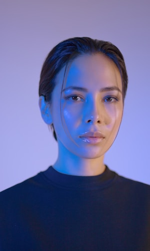 portrait of woman with blue light modern studio photography